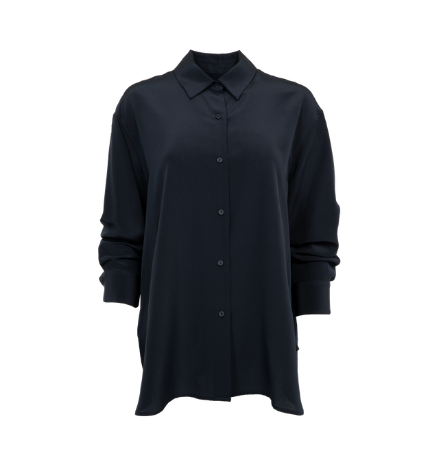 Image 1 of 3 - BLUE - NILI LOTAN Julien Shirt featuring an oversized fit, long-sleeves, button front, dropped shoulder, spread collar, shirred back yoke, curved shirttail hem and tonal buttons. 100% silk. 