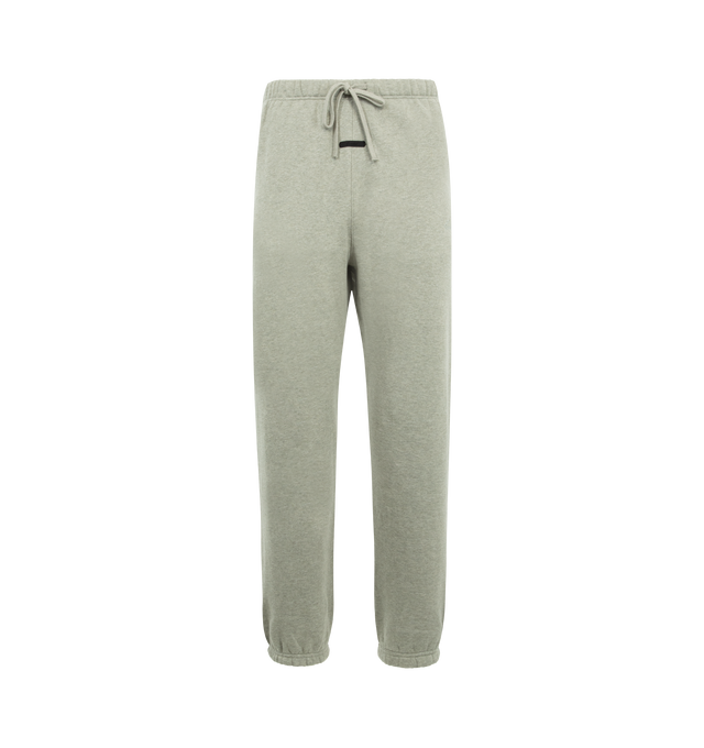 Image 1 of 3 - GREY - FEAR OF GOD ESSENTIALS Signature Classic Sweatpant featuring 380GSM core fleece, relaxed silhouette, elastic hem, encased elastic waistband with elongated drawcords, side seam pockets, embroidered Essentials signature logo on the leg and an Essentials signature label at the center front. 80% cotton, 20% polyester.