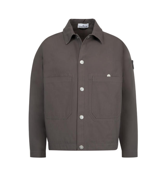 Image 1 of 3 - GREY - STONE ISLAND Coach Jacket featuring snap-fastened throat latch under collar to wear standing, waist-level top-entry patch pockets, vertical hand pockets with tape trim and concealed snap, three internal top-entry pockets; one with snap fastening that is visible on the exterior, Stone Island badge on left sleeve, adjustable cuffs with snap and snap fastening. 100% cotton.