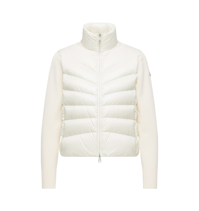 Image 1 of 1 - WHITE - Moncler Womens Wool Down Padded Cardigan is crafted from virgin wool and features a gauge 14 knit, down-filled Longue Saison front and back panels, a turtleneck, zipped pockets, and lightweight insulation. This designer padded cardigan combines premium wool knitwear with signature quilted detailing for versatile everyday layering. Main Material: Sleeves: 100% Virgin Wool; Front & Back: 100% Polyamide; Front Lining: 100% Polyamide; Back Lining: 100% Polyamide; Padding: 90% Down, 10% Fe