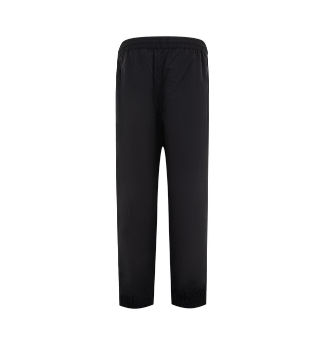Image 2 of 3 - BLACK - WILLY CHAVARRIA Bad Boy Track Pant featuring a relaxed, easy fit, side pockets, elastic waistband and hems, lightweight, stacked double CHAVARRIA logos at the left pocket and double stripes down legs. 100% nylon.