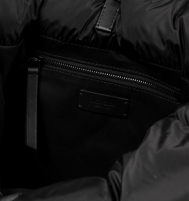 Image 3 of 3 - BLACK - MONCLER Caradoc Water-Repellent Tote Bag featuring nylon technique lining, calf leather trim, down-filled, leather handles, adjustable and detachable shoulder strap, snap button closure and inner zipped pocket. W 45 cm x H 35 cm x D 20 cm. 100% polyamide/nylon. Padding: 90% down, 10% feather. Made in Italy.