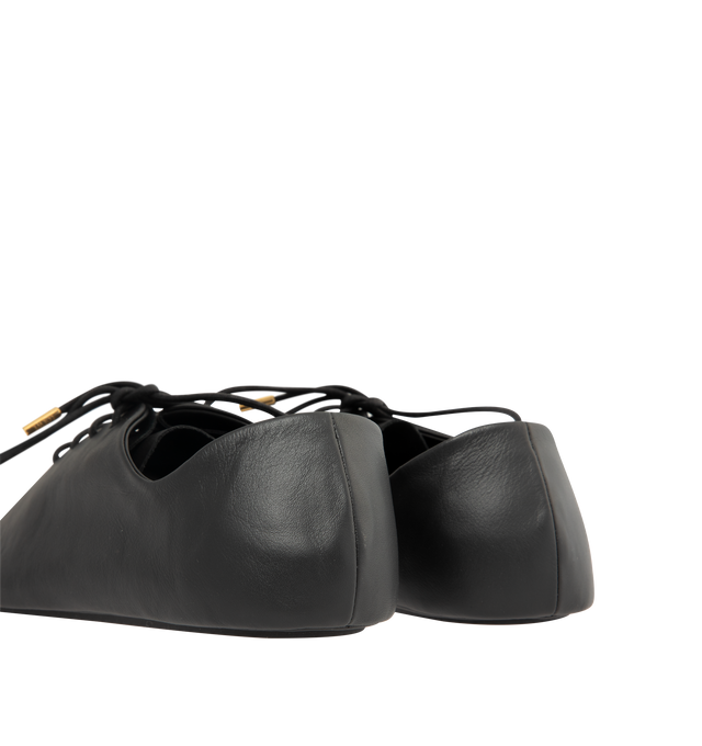 Image 3 of 5 - BLACK - Loewe Womens Nappa Calf Lace-Up Shoes are crafted from nappa calfskin. Features a lace-up closure, extra padding, asymmetric toe shape, tonal laces with metallic tips, metallic Pebble with engraved Anagram detail on the bottom lace, lambskin lining, printed LOEWE insole, and injected rubber outsole with cut-out Anagram signature. Main Material: Nappa Calf. Made in Italy.