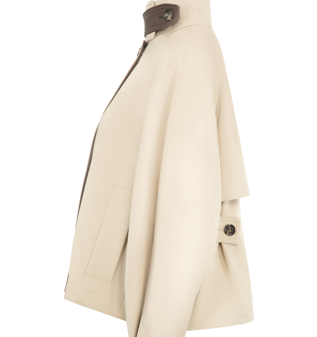 Image 3 of 4 - NEUTRAL - LOEWE Short Parka in lightweight cotton and silk gabardine featuring a high neck with a leather chin strap and a storm flap, relaxed fit, regular length, concealed zip front fastening, raglan sleeves, buttoned tabs at the waist and cuffs, diagonal welt pockets and anagram embroidery placed on the chest. Cotton/silk. Made in Portugal.