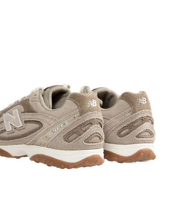 Image 3 of 5 - NEUTRAL - New Balance 204L Unisex sneaker featuring a low-profile silhouette, slim structure of '70s running shoes, tech-inspired texture of premium suede, multi-piece upper with embossed overlay, double-stacked suede 'N' logo, and screen-printed graphics along the saddle. Distinctive outsole with 2000s-inspired strike path and 70s-influenced tread pattern. Outer: Calf Suede 100%, Lining: Fabric 100%, Sole: Polyethylene vinyl acetate (PEVA) 100%. Made in Vietnam. *Unisex style in men's sizing