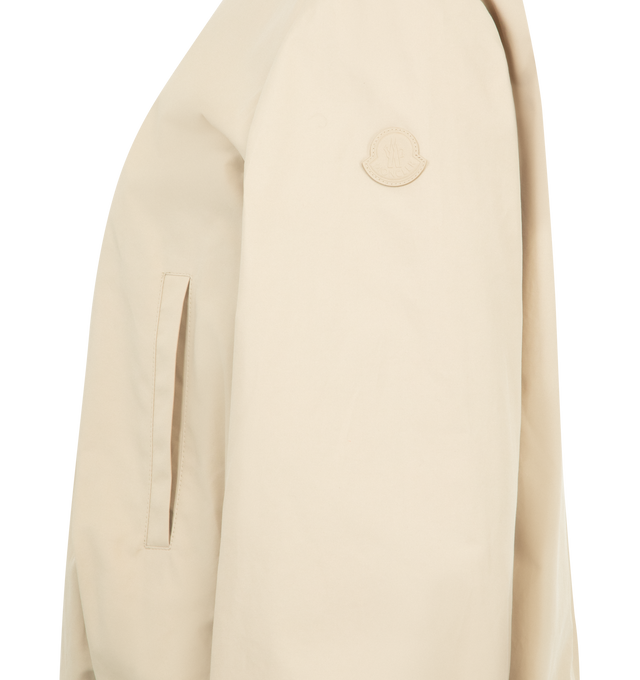 Image 3 of 3 - NEUTRAL - MONCLER Gruissan Padded Jacket featuring a cotton and nylon blend, cotton lining, padded, collar with snap button closure, zipper closure, welt pockets, elastic cuffs and hem and leather logo patch. 64% cotton, 36% polyamide/nylon. Padding: 100% polyester. Made in Romania.
