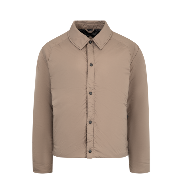Image 1 of 3 - BROWN - CANADA GOOSE Lodge Coach Jacket featuring a pointed collar, packable into interior zip pocket, snap front closure, two exterior zippered pockets and two interior pockets: one drop-in pocket, one zippered security pocket. 100% nylon. Made in Canada.