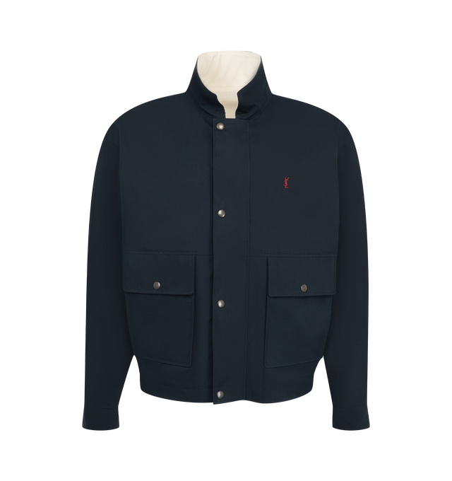 Image 1 of 4 - BLUE - Saint Laurent Mens Reversible Workwear Jacket is crafted from cotton. Features a reversible design, concealed front zip closure with snap-button storm flap, two-way stand collar with embroidered Saint Laurent logo underneath, embroidered Cassandre logo at the chest, snap-button cuffs, two front patch pockets with snap-button flaps, and two welt pockets on both sides. Main Material: 100% Cotton. Made in Italy.