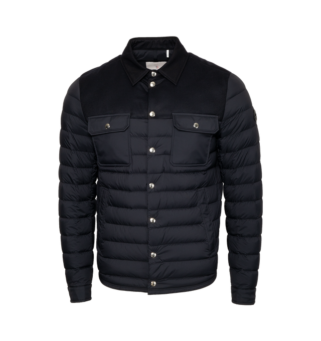 Image 1 of 3 - NAVY - MONCLER Fauscoum Down Shacket featuring recycled longue saison lining, collar and yoke in flannelle legere, down-filled, zipper and snap button closure, pockets with snap button closure, internal zipped pocket, adjustable cuffs and leather logo. 100% polyamide/nylon. Padding: 90% down, 10% feather. 