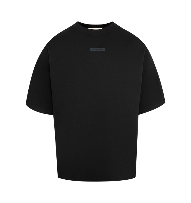 Image 1 of 2 - BLACK - FEAR OF GOD ESSENTIALS Pique 90's Short Sleeve Tee made from medium-weight cotton/poly pique knit featuring a 90s fit with oversized proportions and dropped shoulders. Minimalist branding includes a Fear of God Essentials rubberized label on the center front and the back collar. 100% cotton.
