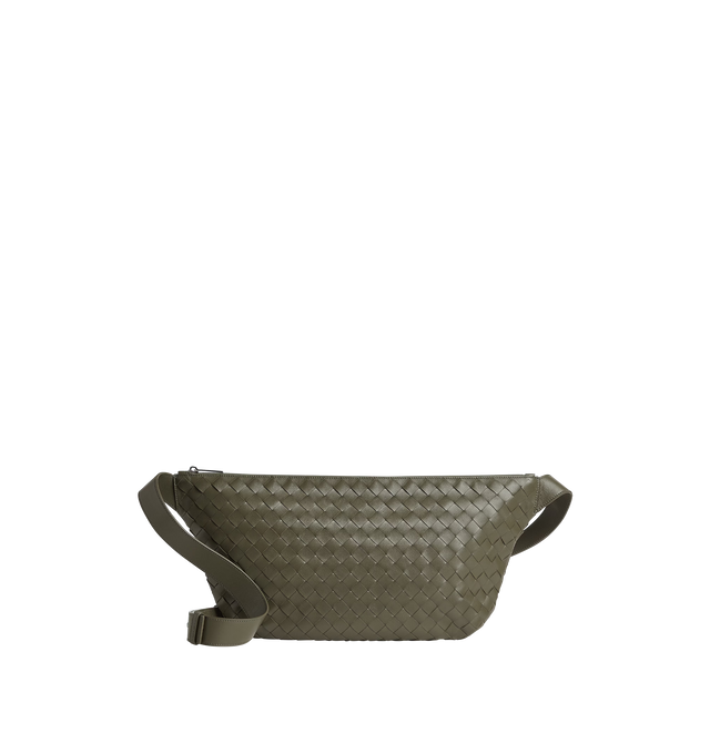Image 1 of 3 - GREEN - BOTTEGA VENETA Intrecciato Day Sling Bag featuring intrecciato leather round sling-bag with adjustable strap, single interior zipped pocket and two flat open pockets and zip closure. Calfskin. Lining: canvas. 10.4" x 18.5" x 2.0". Made in Italy.