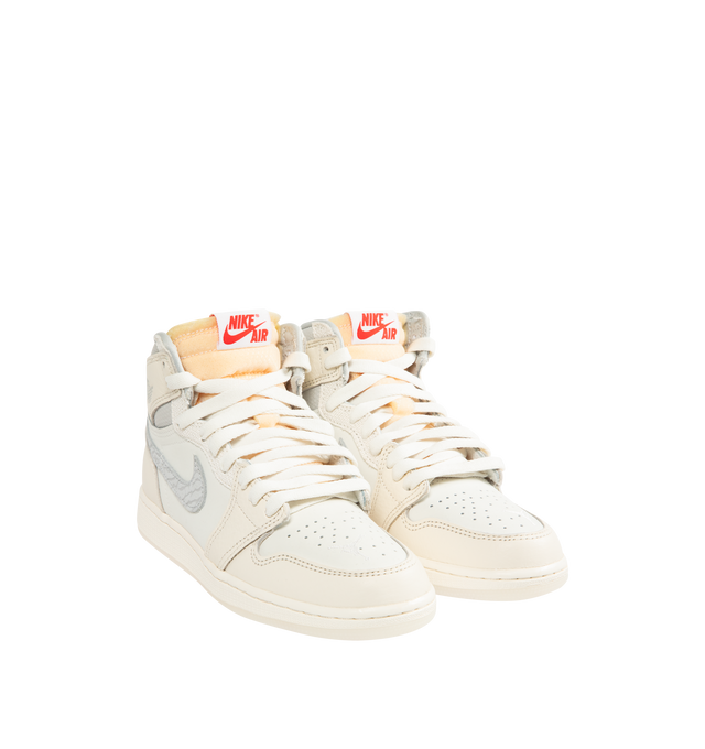 Image 2 of 5 - WHITE - NIKE Air Jordan 1 Retro High OG Sneaker featuring premium leather, elephant print on the Swoosh logo, lace up closure, translucent outsole, exposed foam in the tongue and red contrast stitching on the heel.