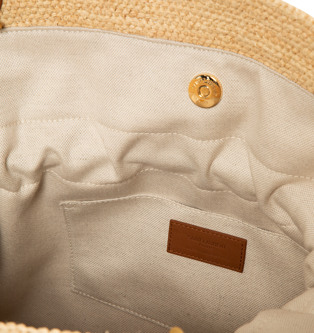 Image 3 of 3 - NEUTRAL - SAINT LAURENT Jamie Shopping Bag in Raffia featuring the cassandre, a chain strap, drawstring ties allow the sides to be cinched or expanded to create different silhouettes, bronze-tone hardware and magnetic closure. 13.8" x 13.8" x 3.9". Strap drop: 12.6". Raffia. Made in Madagascar.