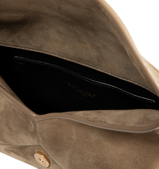 Image 3 of 3 - NEUTRAL - Saint Laurent Womens Chain Pouch is crafted from suede calfskin. Features signature Cassandre logo, magnetic closure, stowable cable-chain shoulder strap, leather lining, one interior card slot, bronze-tone hardware, and dimensions: 19 13 4.5 cm (7.5 5.1 1.8 in) with a 47 cm (18.5 in) strap drop. Main Material: Calfskin Leather; Lining: Leather; Hardware: Brass. Made in Italy.