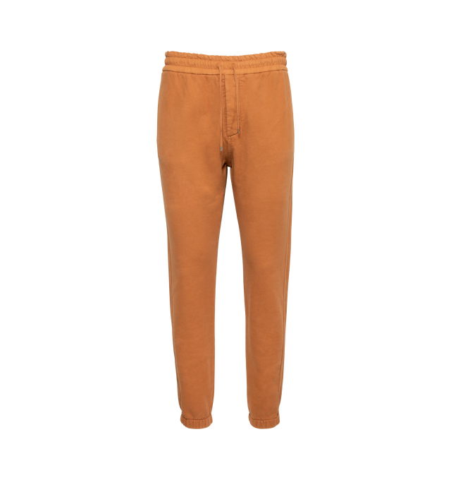 Image 1 of 3 - BROWN - SAINT LAURENT Joggers featuring hidden button closure, two side pockets, elastic waist with drawcord, elasticated hem, two back welt pockets and metal aglets. 100% cotton. Made in Italy. 
