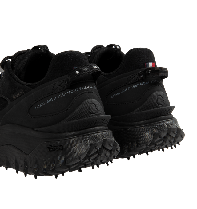 Image 3 of 5 - BLACK - Moncler Trailgrip Apex Low Top Sneakers are a lace-up style with GORE-TEX waterproof membranes, EVA midsoles, Vibram treads, OrthoLite insoles, and TPU spoiler soles. Made in Vietnam.