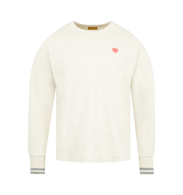 Image 1 of 2 - WHITE - HUMAN MADE Thermal T-Shirt featuring crewneck, ribbed trims, printed branding and stripe cuffs.