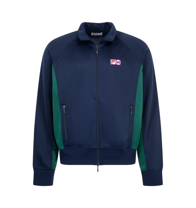 Image 1 of 3 - BLUE - Needles x Fila Men's Ventisei Track Jacket is crafted from polyester and features a heritage-inspired silhouette based on FILA's iconic Settanta Jacket. Designed as part of the first collaboration between Needles and FILA, it is defined by bold color-blocked panels, a large Papillon motif across the back, and a sporty zip-front construction that blends archival sportswear with contemporary styling. Main Material: 100% Polyester.
