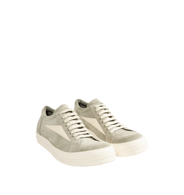 Image 2 of 5 - NEUTRAL - Rick Owens Mens Vintage Sneakers feature a full-grain calf leather and suede upper. Designed with an under-ankle silhouette, eight-eyelet lace-up closure, toe cap, resized triangular leather side appliqu, padded ankle, contrast stitching, and shark-tooth thermoplastic rubber outsole. Upper: 100% Cow Leather; Lateral Details: 100% Calf Leather; Lining: 100% Calf Leather; Insole: 100% Calf Leather; Outsole: 100% Thermoplastic Rubber. Sole Height: 3.5 cm. Made in Italy.