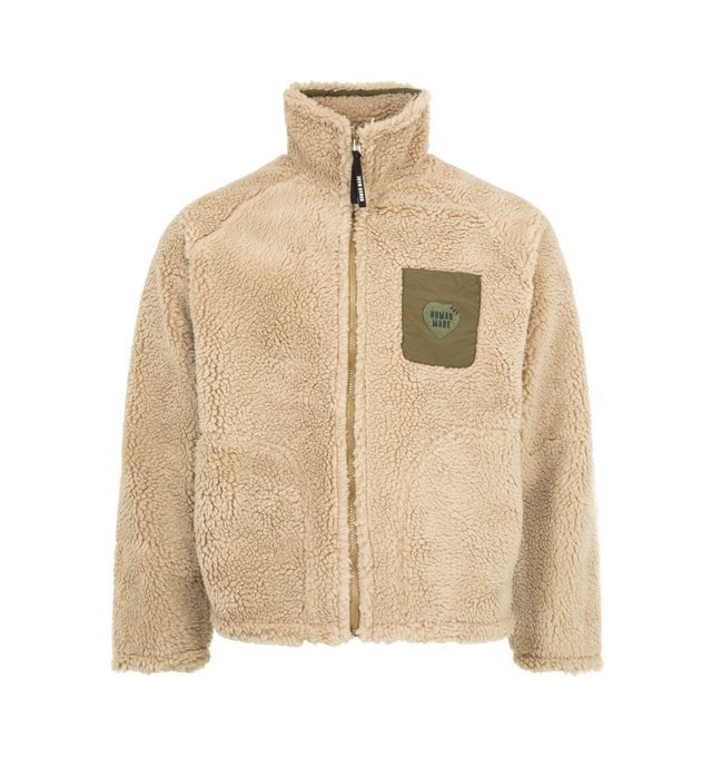 Image 1 of 3 - BROWN - HUMAN MADE Fleece Jacket featuring soft polyester boa fabric, heart-shaped magic tape on the left chest pocket, removing the tape reveals a text graphic, contrasting piping and pockets, chain-stitched animal graphic on the back, heart-shaped snap buttons on the cuffs and mesh lining with wind-proof film. 100% polyester. Contrast: 100% nylon.