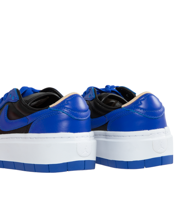 Image 3 of 5 - BLUE - AIR JORDAN 1 ELEVATE LOW has a leather body, colorblocking details on the upper and overlay, a bold Swoosh and on-trend platform sole. This sneaker features an all-leather silhouette, complete with a cork insole and a wing detail on the heel tab, standard lace closure, womens exclusive shoe, perforated toe-box and encapsulated air-sole unit. 