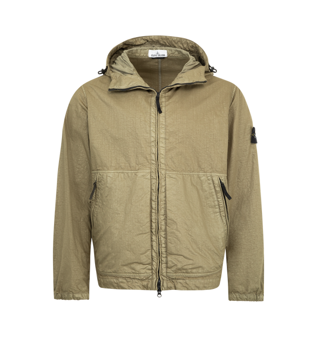 Image 1 of 3 - BROWN - STONE ISLAND Hooded Jacket featuring lined hood with fixed elasticated drawcord, front yoke, angled hand pockets with concealed zipper, Stone Island badge on left sleeve, elasticated cuffs, drawcord with stoppers at bottom hem and high-neck two-way zipper fastening. 100% polyamide/nylon.