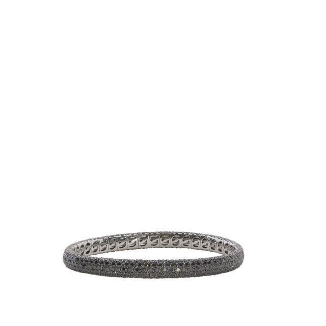 Image 1 of 3 - BLACK - SIDNEY GARBER Pave Stretch: 18k White Gold with Black Rhodium and Black Diamonds Narrow Pave Stretch Bracelet, 7.85ct, 16.5cm. This classic bracelet is paved with diamonds in a smooth, perfect circle. It also has a little trick up its sleeve: We made it to be entirely flexible so it slips on without a clasp. Diamonds 7.85 Carats, 18k White Gold with Black Rhodium. Approximately 0.25 Inch Wide.
