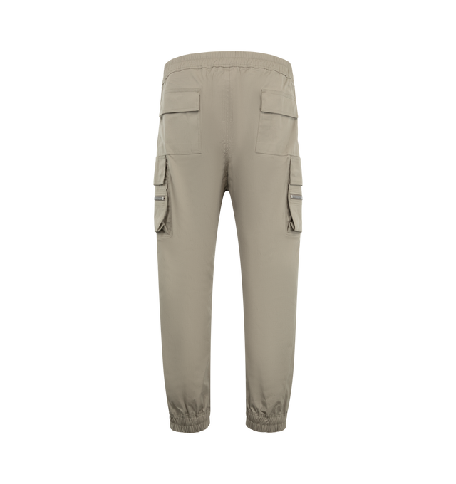 Image 2 of 3 - GREY - Rick Owens Men's Mastodon Cargo Pants are crafted from lightweight feather material and feature a slim-fit, full-length silhouette with an elasticized drawstring waistband. Designed with side pockets, zippered cargo pockets at the thighs, back flap pockets, and elasticized ankles, the style combines utilitarian detailing with a streamlined profile.