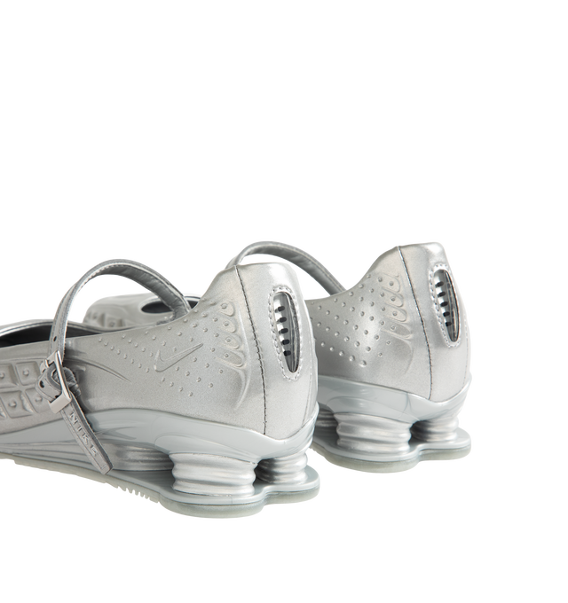 Image 3 of 5 - SILVER - Nike Womens Shox Z Calistra Shoe is a ballet-inspired flat on top of sleek sneaker-inspired heel cushioning. Designed with an adjustable midfoot strap, Nike Shox Z cushioning pillars, signature Nike and Shox branding, and durable rubber outsole. Upper: Synthetic Leather; Cushioning: Nike Shox Z; Outsole: Rubber. Imported