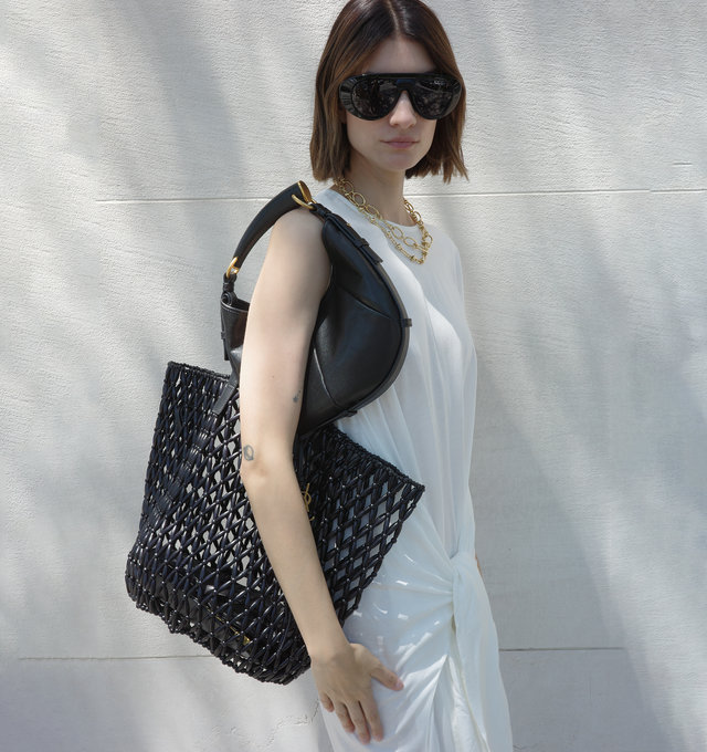 Image 2 of 4 - BLACK - SAINT LAURENT Beaded Shopping Bag featuring a distinct, unlined, and handcrafted design, two leather flat handles and a detachable leather keychain accessory. 35 cm x 29 cm x 25 cm. 100% wood beads. Made in Italy.