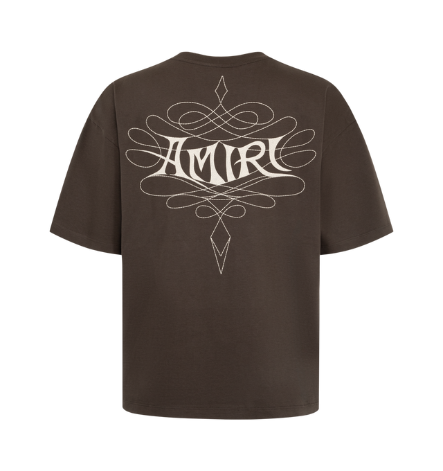 Image 2 of 2 - BROWN - Amiri Men's Lasso Oversized T-Shirt is crafted from cotton and features a relaxed oversized silhouette with signature Lasso graphic artwork for a bold Western-inspired finish. This designer graphic T-shirt combines premium everyday comfort with Amiri's distinctive luxury streetwear aesthetic, making it an effortless statement piece for casual styling. Main Material: 100% Cotton.