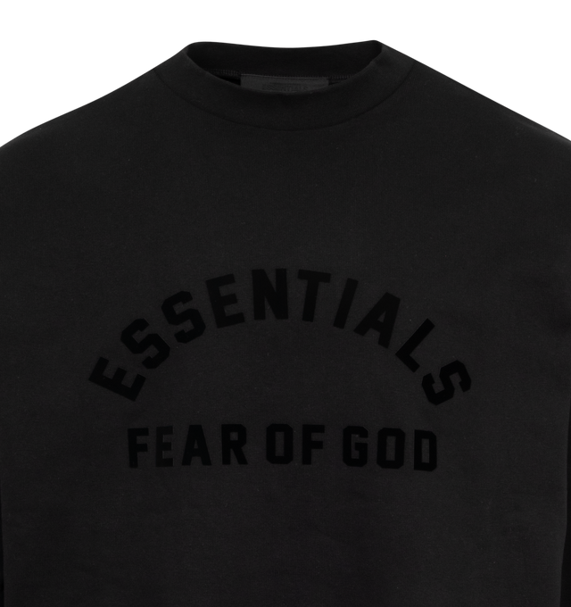 Image 2 of 2 - BLACK - FEAR OF GOD ESSENTIALS Crewneck Long Sleeve T-Shirt featuring rib knit crewneck and cuffs, logo bonded at front, dropped shoulders and rubberized logo patch at back. 100% cotton. Made in Viet Nam. 