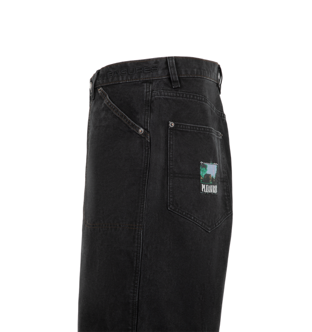 Image 3 of 3 - BLACK - Pleasures Men's Ultra Work Shorts are crafted from durable cotton canvas and feature a relaxed, baggy workwear-inspired silhouette. Designed with a zip fly, metal shank button closure, and reinforced metal rivets, the shorts are finished with contrast stitching at the front pockets and a woven logo patch at the back pocket. Main Material: 100% Cotton Canvas.