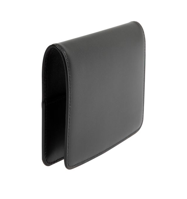 Image 2 of 3 - BLACK - Saint Laurent VOLTAIRE passport holder with inner card slots, decorated with the CASSANDRE. Featuring leather lining, bronze-toned hardware, two flat pockets, five card slots. Measures 5.3" x 3.9" x 0.8". Made in Italy.