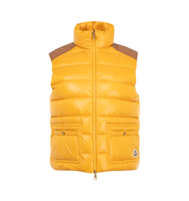 Image 1 of 1 - YELLOW - Moncler Women's Frelon Down Vest is crafted from glossy nylon laqu and features a down-filled construction, a front zip closure, snap-button patch pockets, and the signature logo patch. This designer down vest combines lightweight warmth with a sleek, feminine silhouette for elevated everyday layering. Main Material: 100% Polyamide (Nylon). Lining: 100% Polyamide (Nylon). Padding: 90% Down, 10% Feather. Made in Moldova.