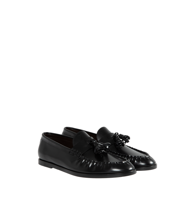 Image 2 of 4 - BLACK - THE ROW Loafer featuring sleek calfskin leather with natural pleating effect and tassel detailing. 100% leather. Made in Italy. 