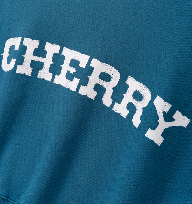 Image 4 of 7 - BLUE - Cherry LA Men's Patch Work Henley Crew is crafted from custom cotton fleece and features a boxy-fit silhouette with patchwork detailing at the chest and a concealed-button Henley placket. Designed for everyday comfort, this elevated sweatshirt is finished with hidden front buttons and a signature branded label at the cuff. Main Material: Custom Cotton Fleece. Made in Los Angeles, California.