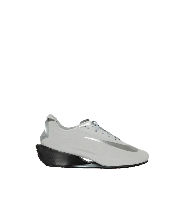 Image 1 of 5 - SILVER - Nike First Sight Noir Sneakers feature smooth textile uppers with tonal rubber overlays and a sculpted wedge sole for a futuristic take on retro running style. These lifestyle sneakers combine lightweight comfort with modern design, finished with chrome-effect detailing at the heel for a bold statement. Main Material: Textile and Synthetic. Sole: Rubber.