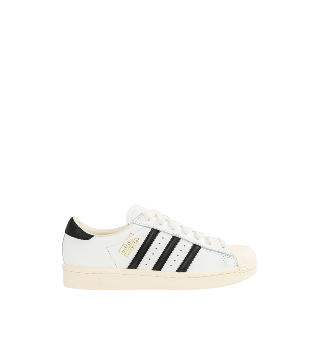 Image 1 of 5 - WHITE - ADIDAS Superstar Vintage Sneaker featuring shell toe, 3-Stripes and heel tab, a leather upper, lining and insole all sits atop a classic rubber cupsole, regular fit, lace closure and rubber outsole.