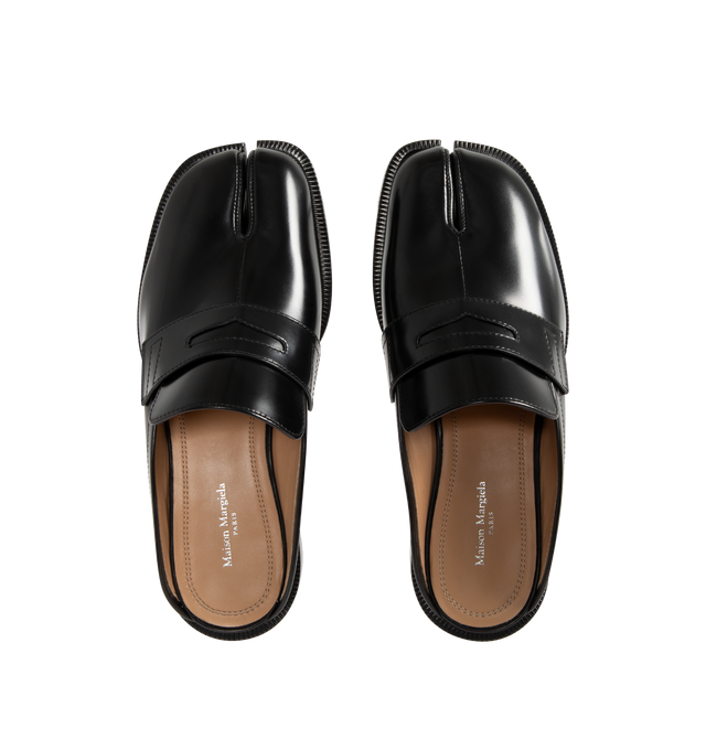Image 4 of 4 - BLACK - MAISON MARGIELA Tabi City Loafer Mules featuring polished calfskin, slip-on, square cleft toe, strap with cutout at vamp, logo stamp at padded footbed, buffed lambskin lining, serrated edge at welt, stacked leather heel with rubber injection and leather sole. Upper: calfskin. Sole: leather, rubber. Made in Italy.