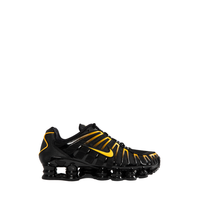 Image 1 of 5 - BLACK - NIKE Shox TL Sneaker featuring Nike Shox technology, a combination upper with a full TPU cage, molded overlays throughout the midfoot, a TPU plate in the heel between the midsole and Nike Shox technology, foam midsole for lightweight cushioning, non-marking, solid rubber in a modified waffle outsole and synthetic and textile upper.