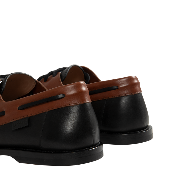 Image 3 of 4 - BROWN - Loewe Men's Campo Boat shoe in two-tone soft calfskin featuring the LOEWE signature round toe shape and a hand-sewn construction with a supple leather lining and flexible sole. Features 20mm heel, squared leather lace closure, padded leather insole, rubber-injected leather outsole, removable Flamenco knot and LOEWE embossed tag placed at the side. Made in Italy.