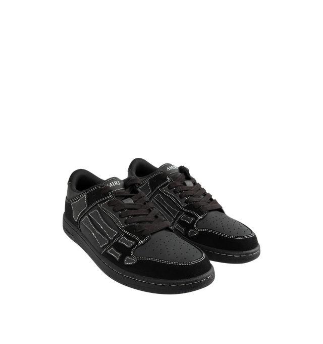 Image 2 of 5 - BLACK - AMIRI Skel Top Low Sneaker featuring low-top sneaker crafted with hand-cut skeletal appliqus along the sidewalls, perforated toe, padded collar, molded insole and lace-up style. Leather upper, textile lining, rubber sole.