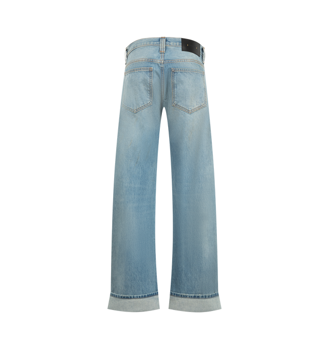 Image 2 of 3 - BLUE - Khaite Women's Karo Jean is crafted from rigid cotton denim and features a low-rise silhouette designed to sit low on the hips, detailed with curved seams that create a bowed leg shape, cuffed hems, classic five-pocket styling, and an antiqued nickel embossed button closure. Main Material: 100% Cotton. Made in USA.