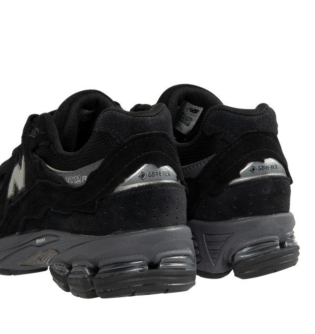 Image 3 of 5 - BLACK - NEW BALANCE 2002DX Sneaker featuring soft French terry fabric, ABZORB midsole, ABZORB SBS heel cushioning, N-ergy technology for superior shock absorption, atability Web outsole technology and GORE-TEX waterproof fabric.