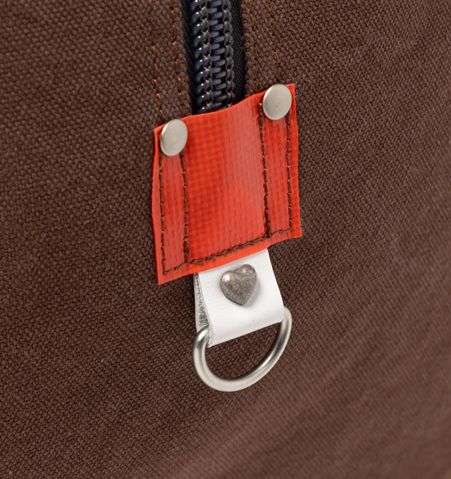 Image 6 of 8 - BROWN - HUMAN MADE Canvas Boston Bag Large featuring thick, tough cotton canvas, bio-washed for a vintage-like feel, graphics appear on both sides, external pocket and an internal zip pocket, heart-shaped rivets and 100L capacity. 100% cotton.