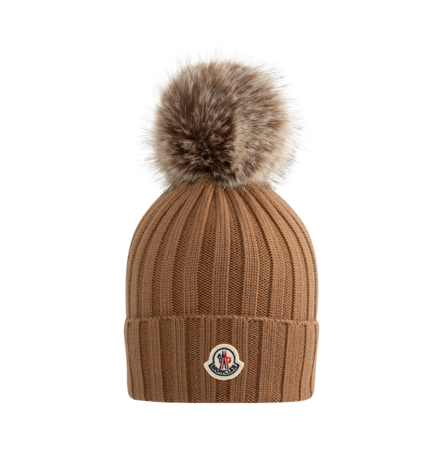 Image 1 of 2 - BROWN - MONCLER Wool Beanie with Pom Pom featuring Merino wool, ribbed knit and faux fur pom pom. 100% virgin wool.