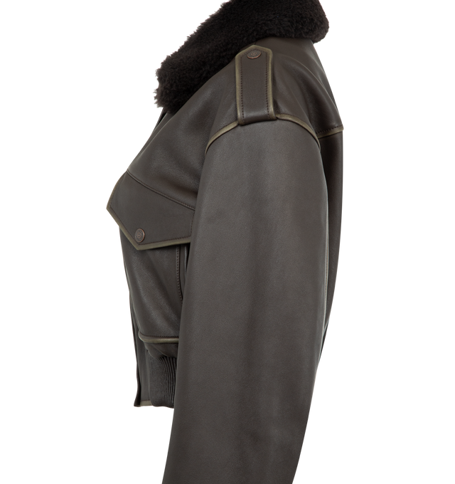 Image 5 of 5 - BROWN - ACNE STUDIOS Leather Bomber Jacket featuring soft lamb leather with a shearling collar, dropped shoulders with epaulettes, front flap pockets, side welt pockets, an elasticated hem, front snap button, zipper closure, zip sleeves, a metal logo plaque at the back neckline, relaxed fit and below-waist length. 100% Lamb leather. 100% Lamb shearling. Lining: 100% viscose.