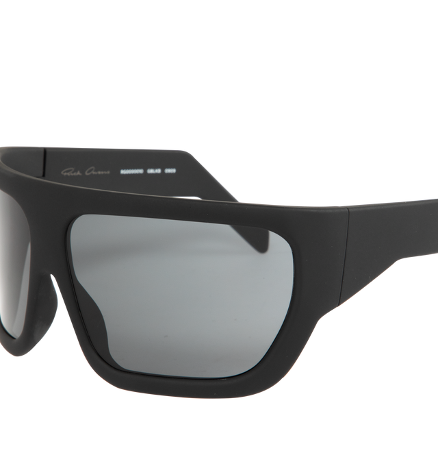 Image 3 of 3 - BLACK - RICK OWENS Davis Sunglasses featuring large wrap around frames with geometric curved lenses, thing angles arms and logo on the inside right. Frame: 100% grilamid. Lenses: 100% nylon. 100% UVA/UVB protection.