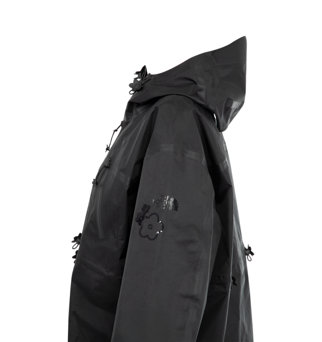 Image 3 of 3 - BLACK - TNF X CB Fiona Short Mountain Jacket featuring a cinched waist, scalloped hem of glossy floral appliqus and delicate flower zipper pullers, all-weather protection, fully adjustable hood, water-repellent finish, and matte black seam tape. 100% nylon. Lining: 100% polyester.